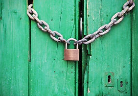 wooden-green-door-locked-with-padlock.jp