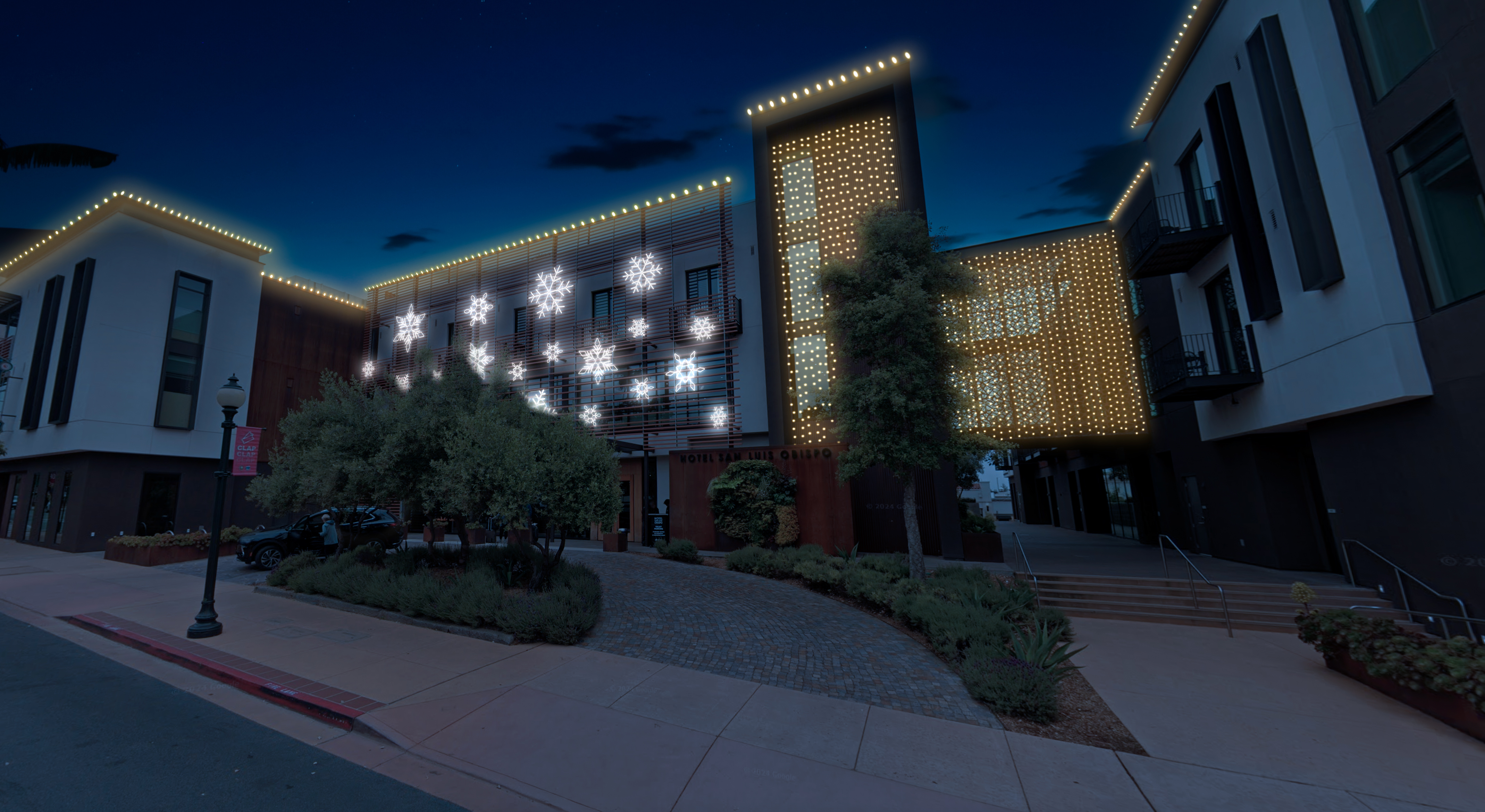 Building with lit snowflake decor