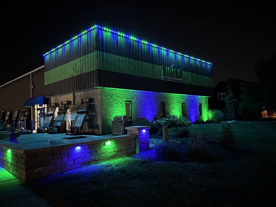 Commercial building with green and blue permanent lighting