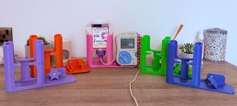 Picture of all the Feed & Go stands lined up in every colour.