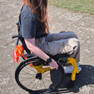 Young disabled person using assistive technology to stay independent
