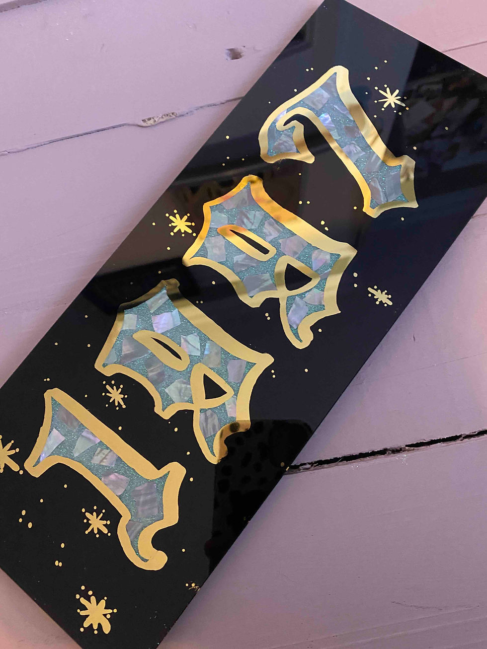 black and gold year date sign