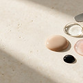 Gel swatches and clear professional nail-system textures on warm porcelain