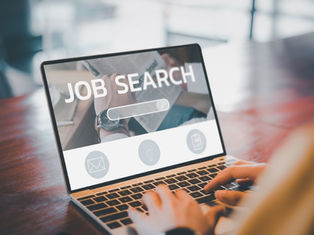 Malaysian job seeker scrolling through online job listings, reflecting economic pressure and rising job scams.