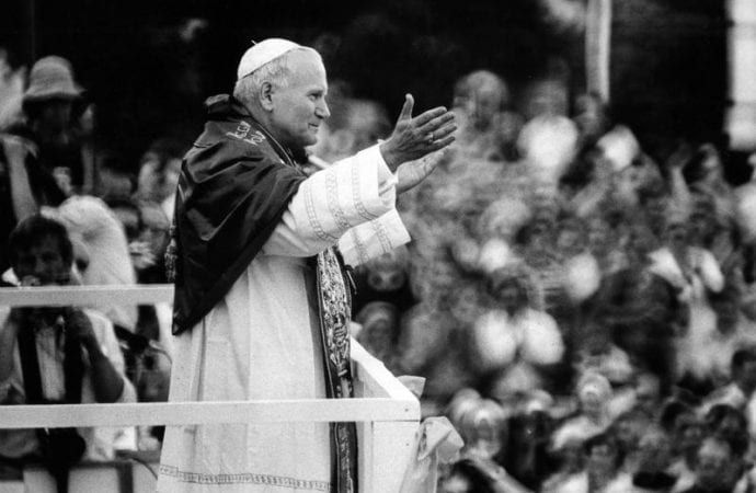 St. John Paul II greets throngs of Poles waiting for a glimpse of their native son at the monastery of Jasna Gora in Czestochowa during his 1979 trip to Poland. White House officials marked the 40th anniversary of St. John Paul II's first pilgrimage to Poland with a June 21, 2019, screening of "The Divine Plan" about President Ronald Reagan's and the late pontiff's anti-communism efforts. (Credit: Chris Niedenthal/CNS.)