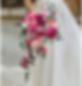 Cascading bridal bouquet with cerise and blush pink roses and peonies