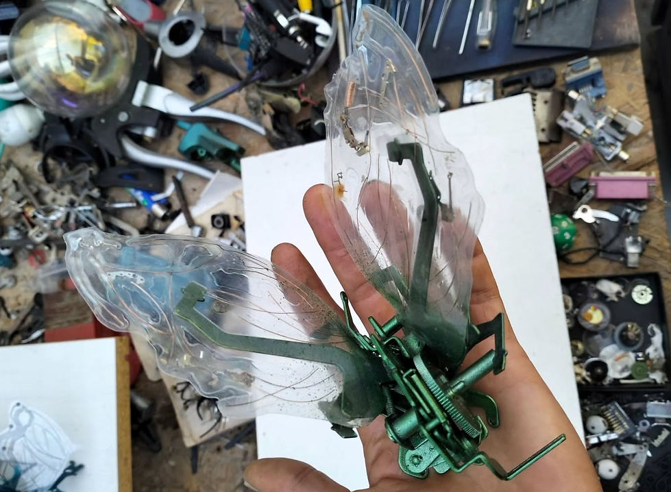 sculpture studio, work in progress, a small sculpture made from electronic and analog waste.