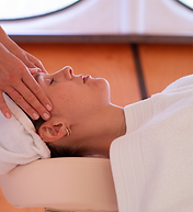 a woman having a facial