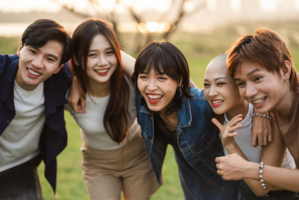 A group of friends posing for a photo on a field