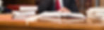 Image of Person Reading Book at Desk.