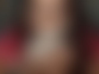 A stressed looking woman holding a rabbit