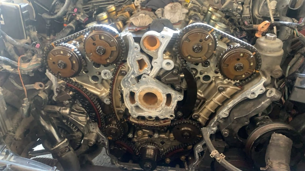 Eye-level view of a mechanic working on a car engine