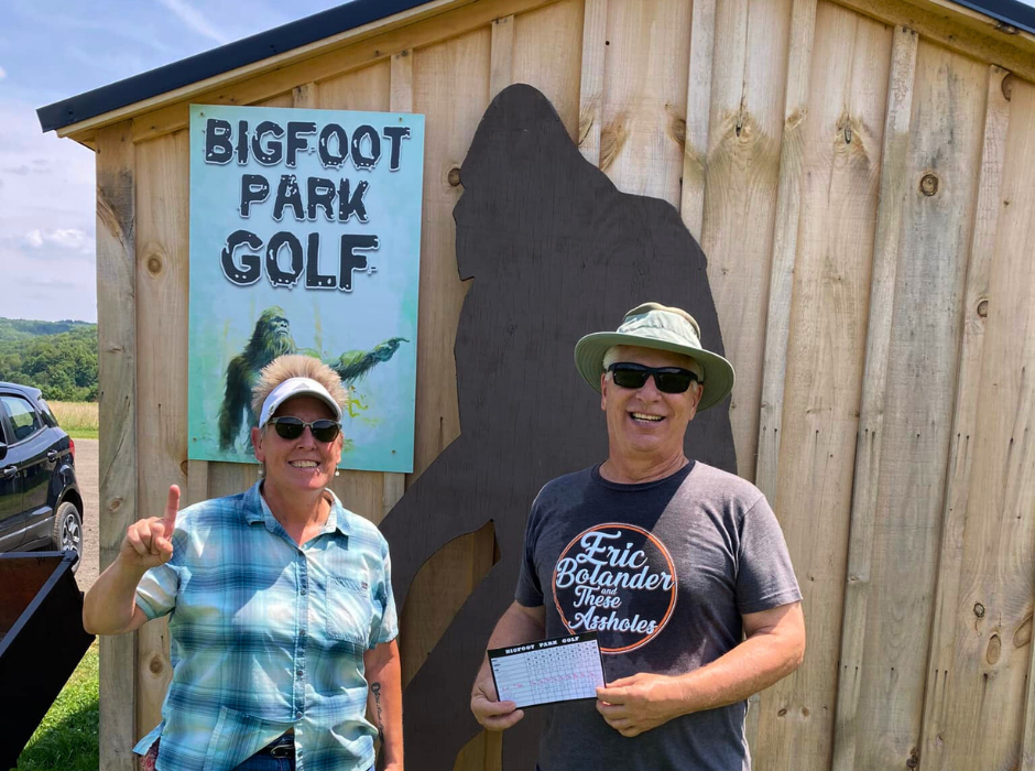 A Couple playfully posing with a Bigfoot silhouette at Bigfoot Park Golf in Ellicottville, NY.”