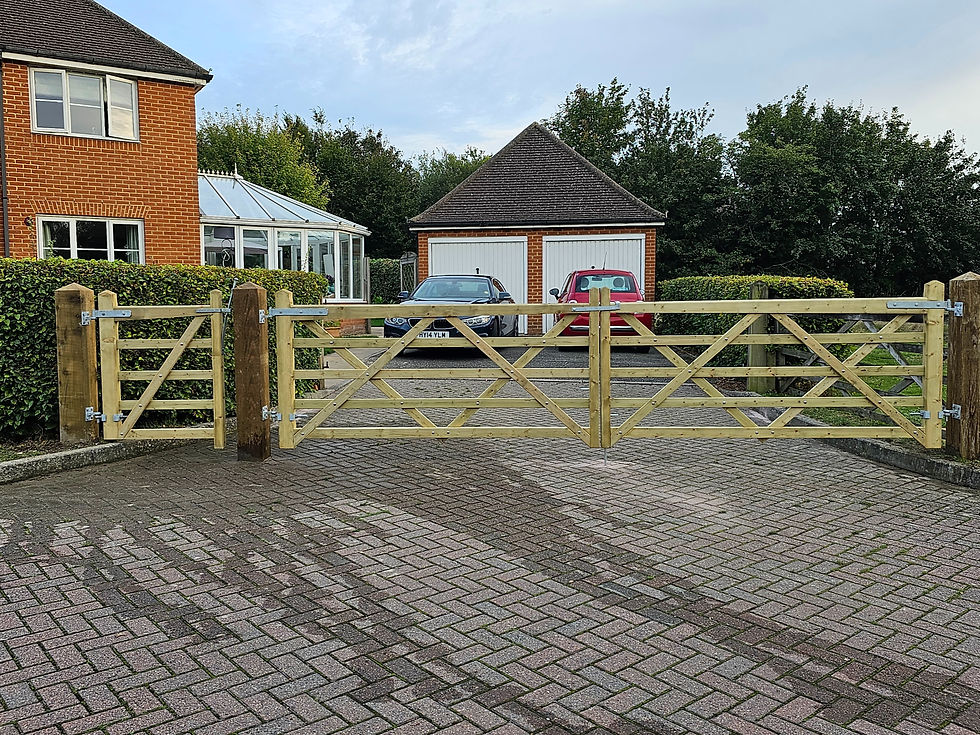 A wooden gate on a paved driveway, an example of swing gate installation in Kent