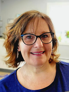 smailing female optician with glasses