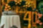 Champagne glasses, gold 40, and balloons for a celebration