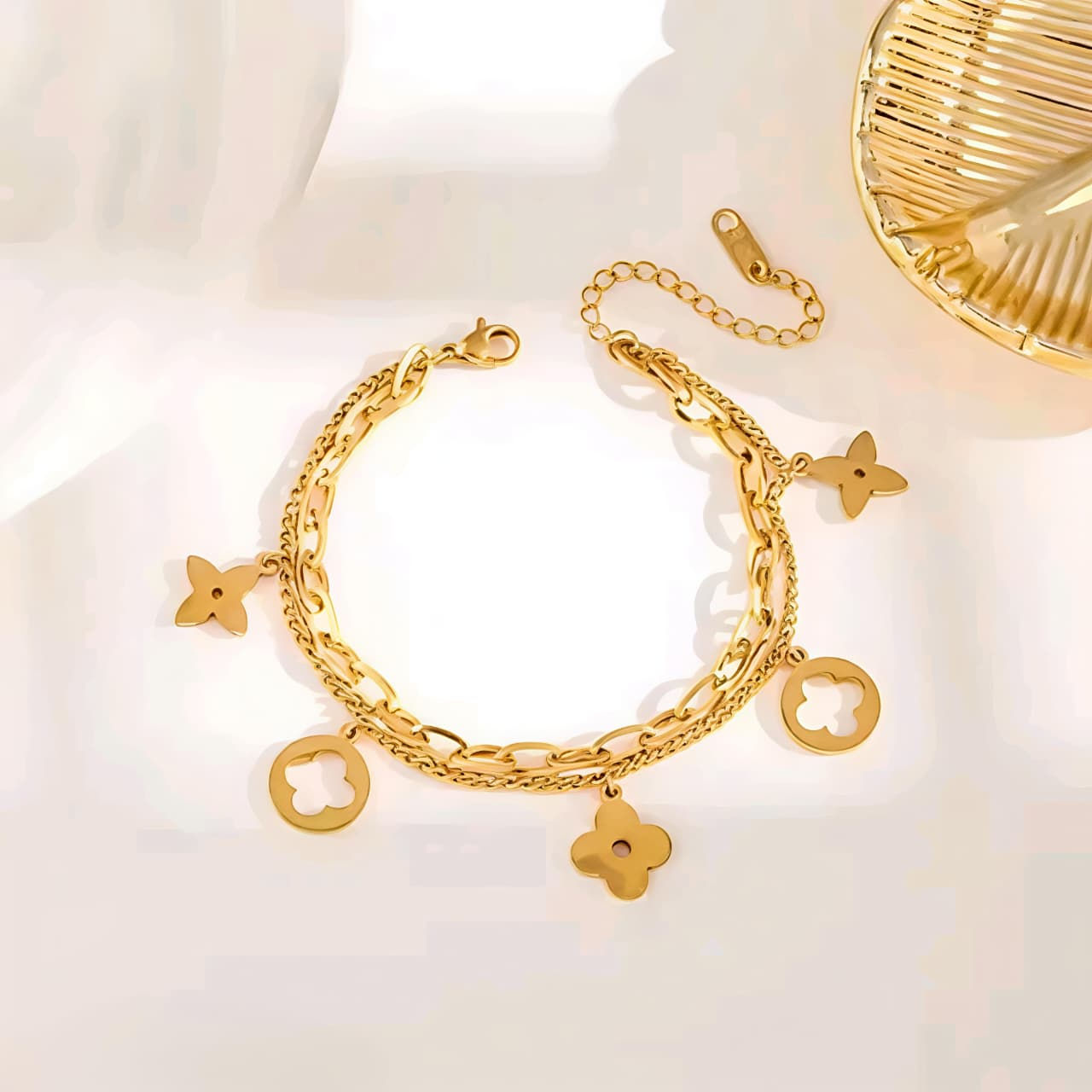 Two-layer gold bracelet with clover charms