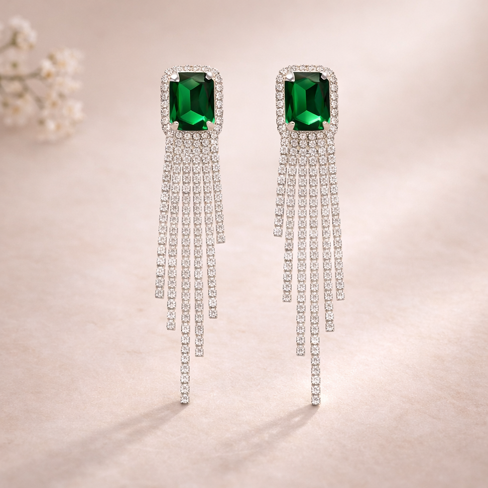 Dangling earrings with emerald green gemstones and crystal strands