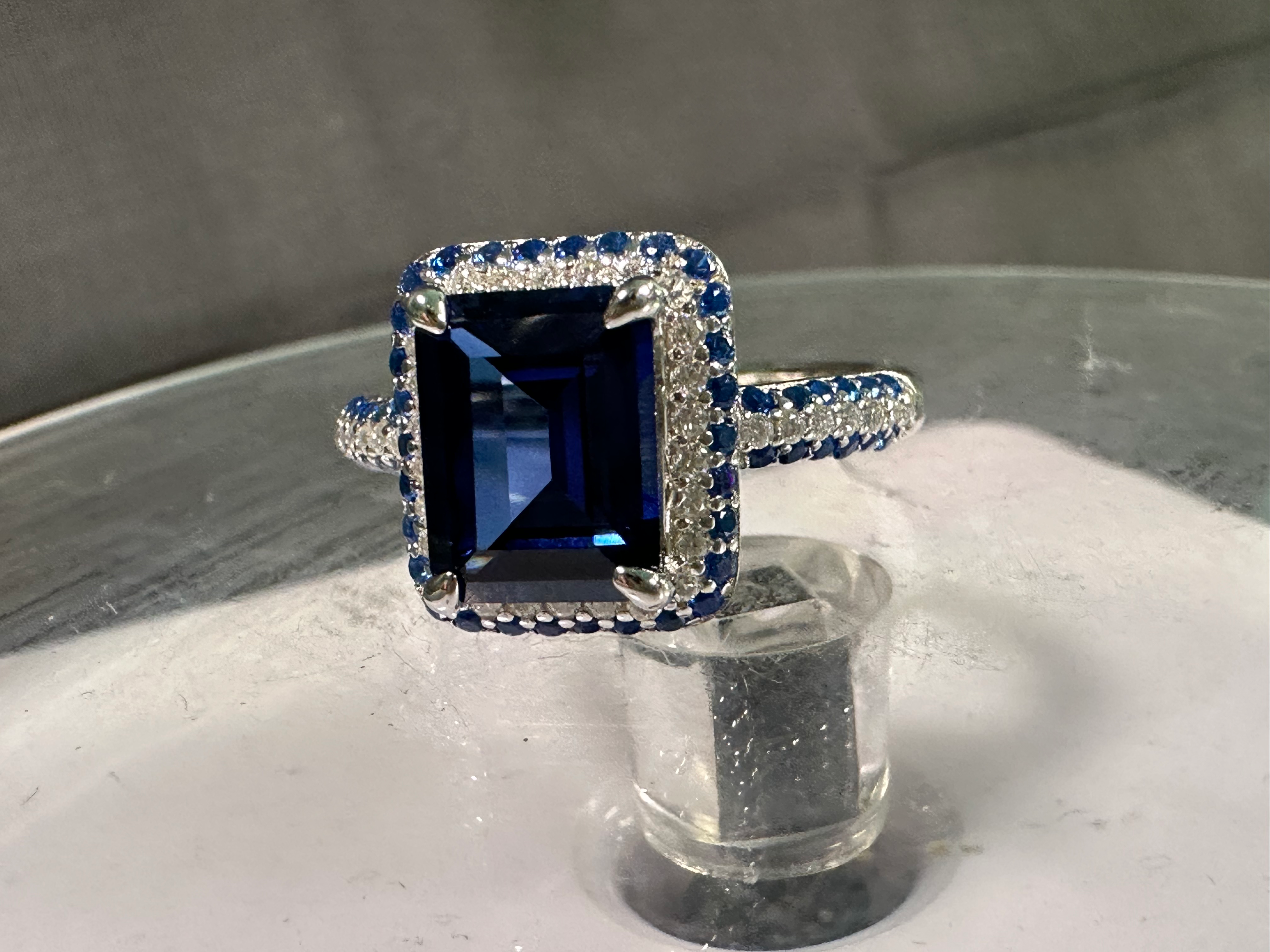 Blue Lab Grown Sapphire with VVS1 Emerald Outer Stones