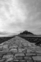 St Michael's Mount causeway view in black and white portrait