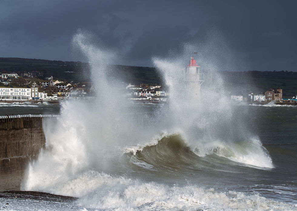Waves splashing over the harbour wall at Newlyn Greeting Card