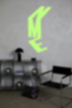 NME office setting with logo on wall