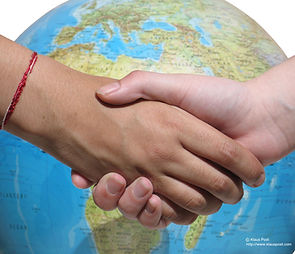 handshake in front of globe