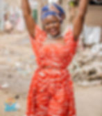 Smiling woman in a red patterned outfit