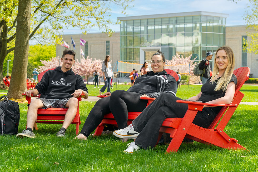 Students sitting in chairs on a college campus photo by NGS Productions