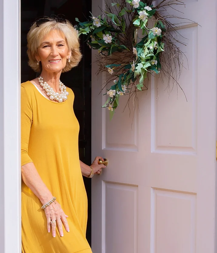 Meet Kim - Kim at her front door.webp