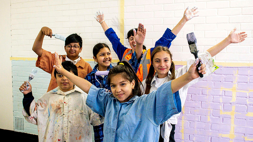 Kids painting and celebrating