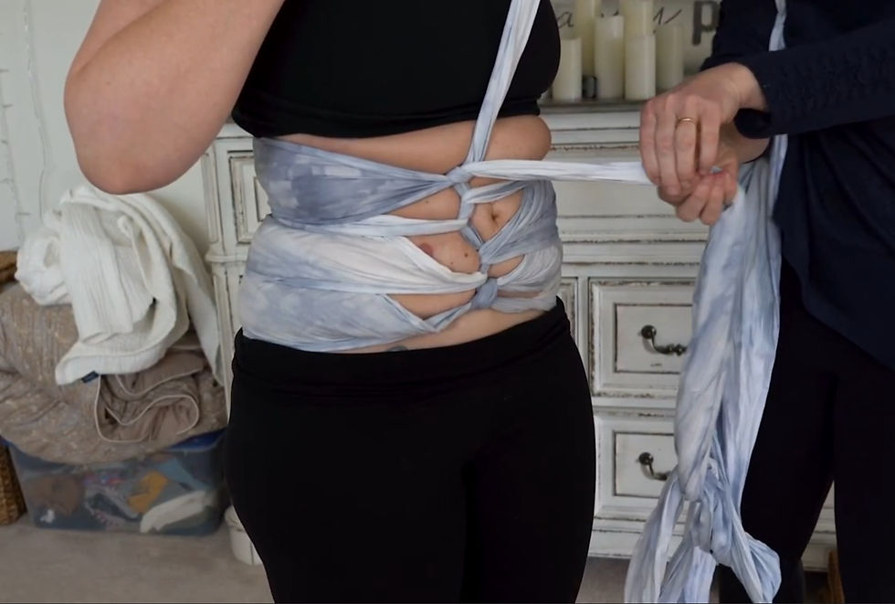 Postpartum belly binding in progress using a traditional wrap, supporting abdominal healing and recovery after birth in Highlands Ranch.