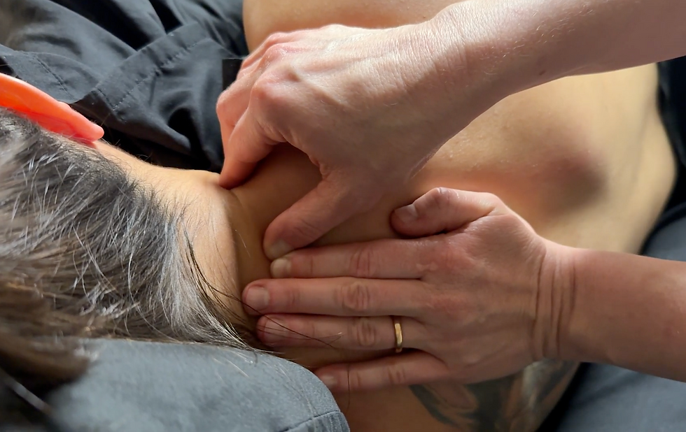 Close-up of neck and shoulder massage to relieve deep muscle tension, part of therapeutic bodywork at Take Care Mama in Highlands Ranch.
