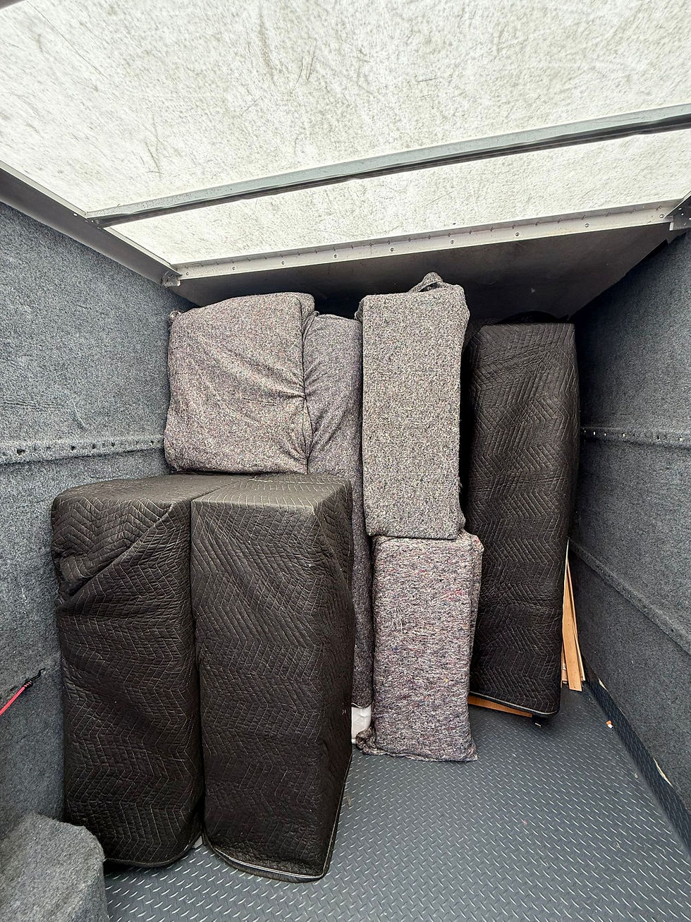 Close-up view of packed moving boxes stacked and labelled