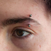 eyebrow piercing with anatometal titanium curved barbell