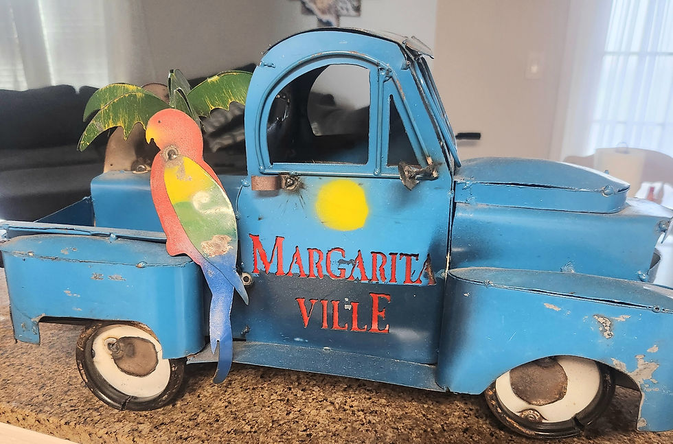 The hand-made, decorative metal blue truck belonging to the author.