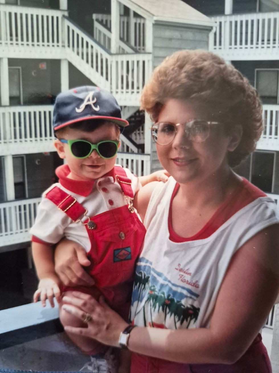Dorinda holds Alex outside a condo in Gulf Shores during his first visit to the beach in 1993.