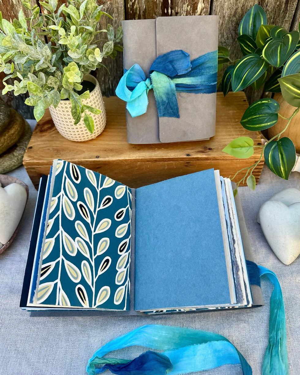 Thumbnail: handmade leather journal with blue inside pages