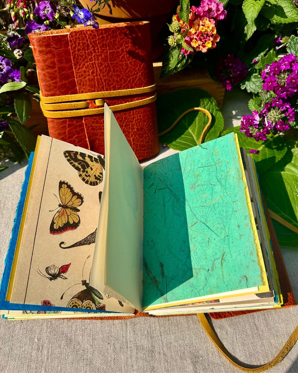 Thumbnail: handmade leather journal with butterfly paper