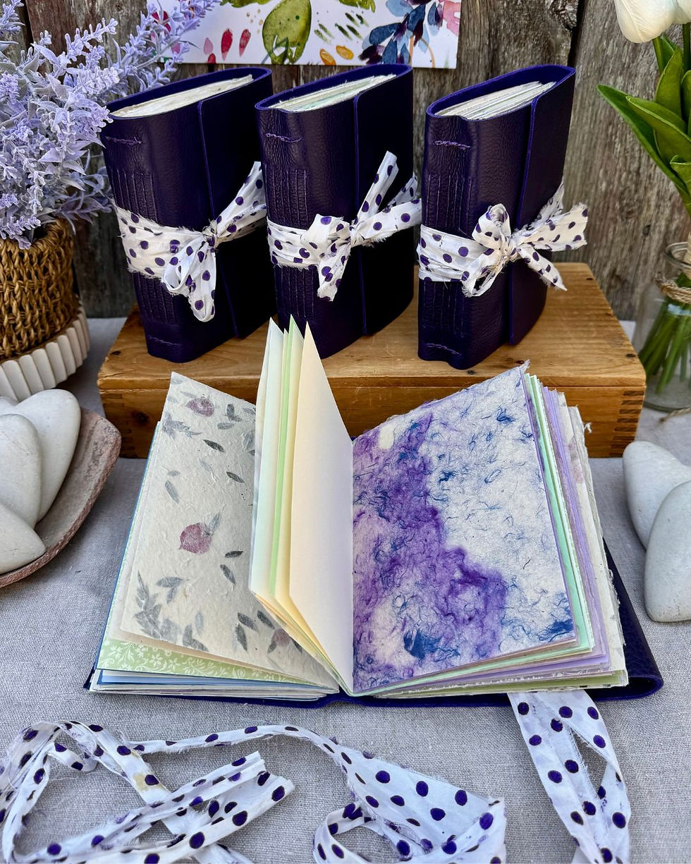 Thumbnail: purple leather journal with purple artist papers