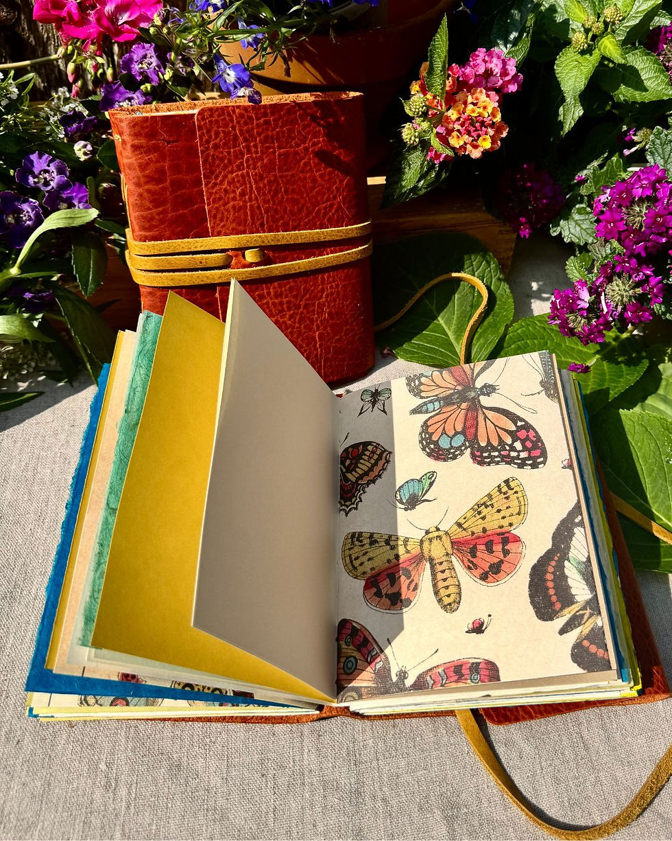 Thumbnail: handmade leather journal with butterfly paper