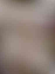 spines of handbound books showing stitching and different paper types