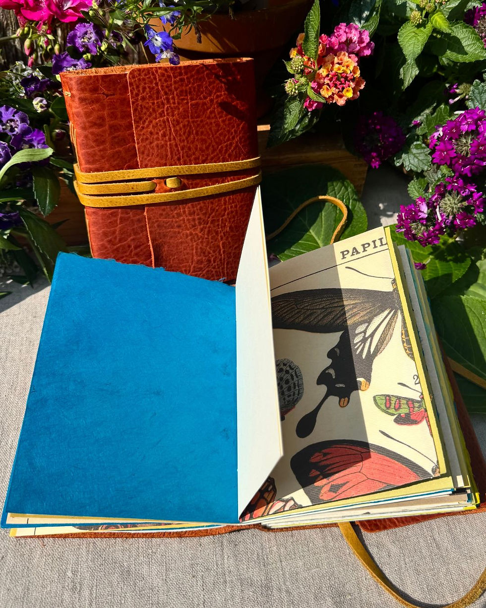 Thumbnail: handmade leather journal with butterfly paper