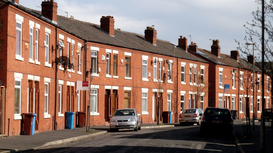 Typical UK street lined with terraced houses, offering potential for property investors.