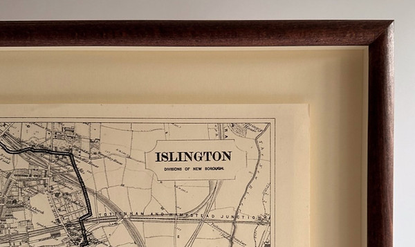 map of islington framed in a stained har