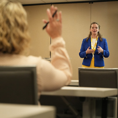 Elise Woodworth in a interactive workshop preparing to answer a queston from an audiance member.