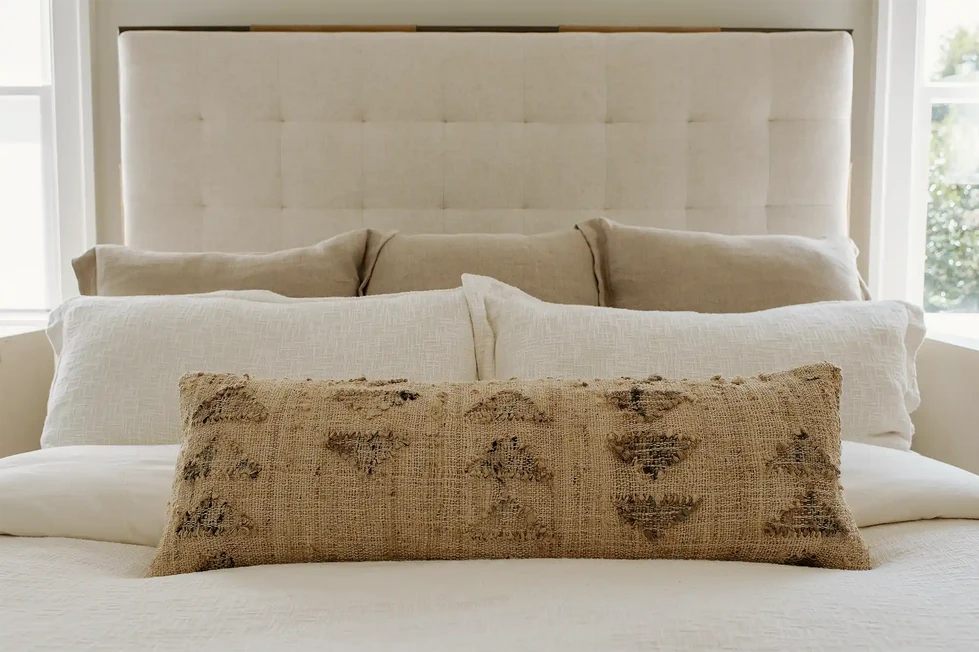 neutral primary bedroom | neutral master bedroom | organic modern | neutral bedding | cream tufted headboard | textured bed pillows | beige bed pillow | lumbar pillow | bedroom decor | white bed pillows