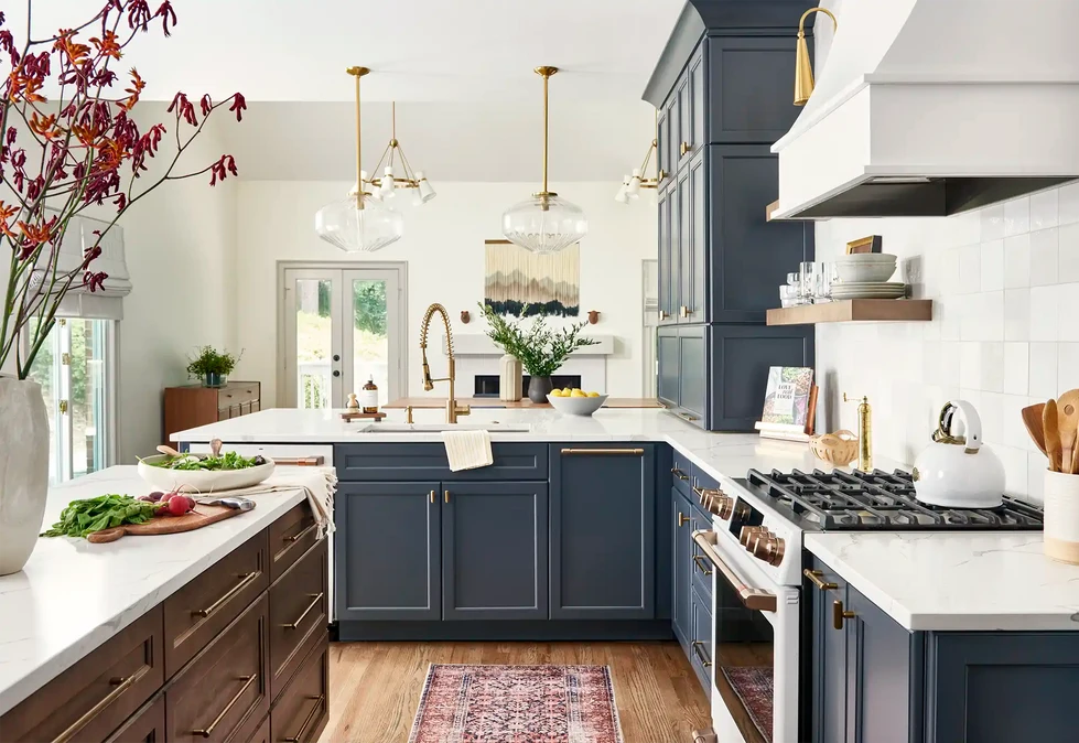 Kosher kitchen renovation | dark blue kitchen cabinets | two kitchen sinks | kitchen island | kitchen glass pendant lights