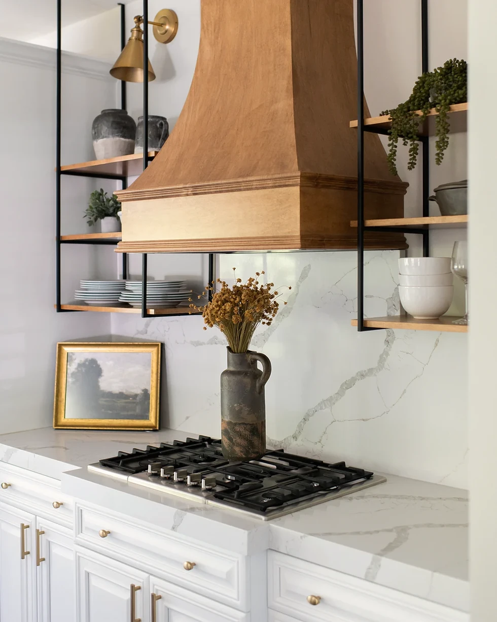 White kitchen | stained wood hood | wood range hood | ceiling mounted shelving shelves