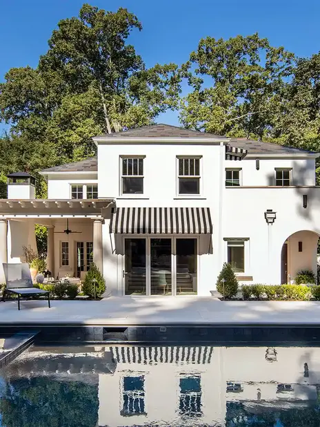 Home exterior makeovers and renovations designed by HouseLift Design | Atlanta, GA | exterior design | paint consult | bed swing | painted brick | landscape architecture | poolscape